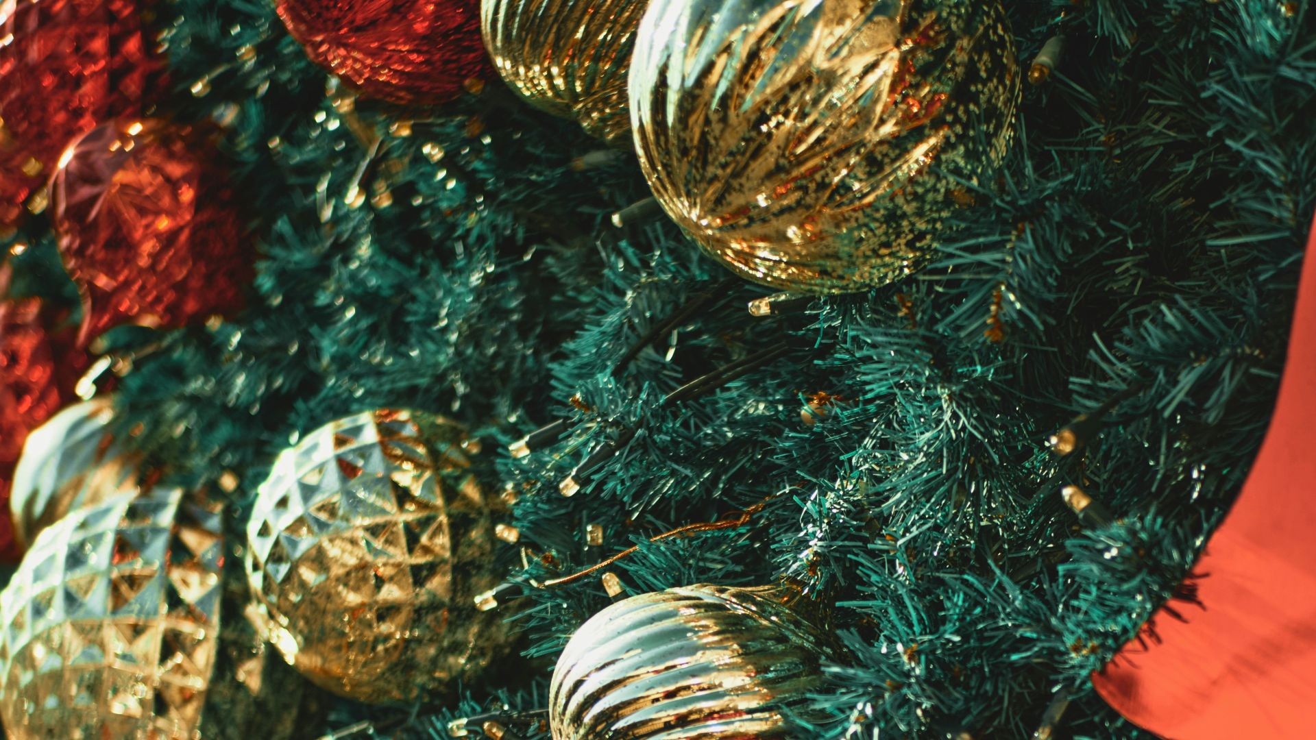 red and silver baubles on green christmas tree