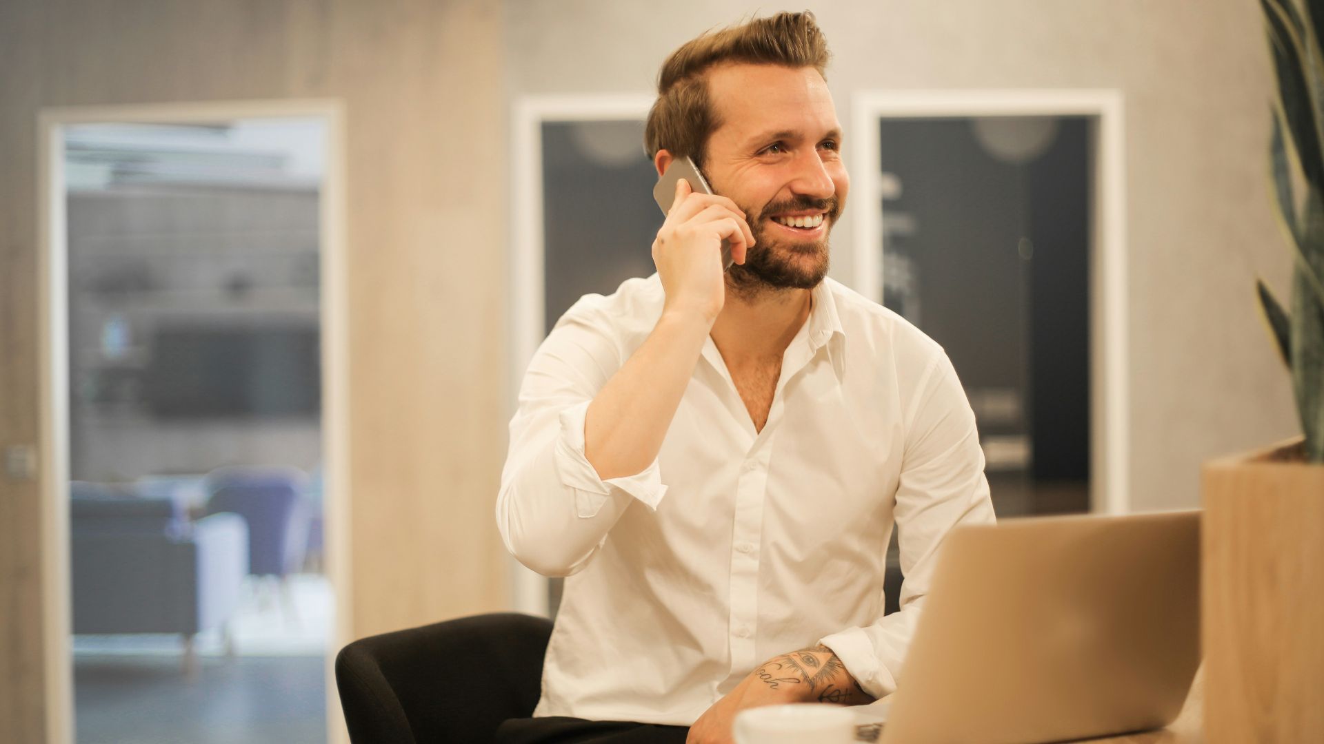 man using smartphone on chair