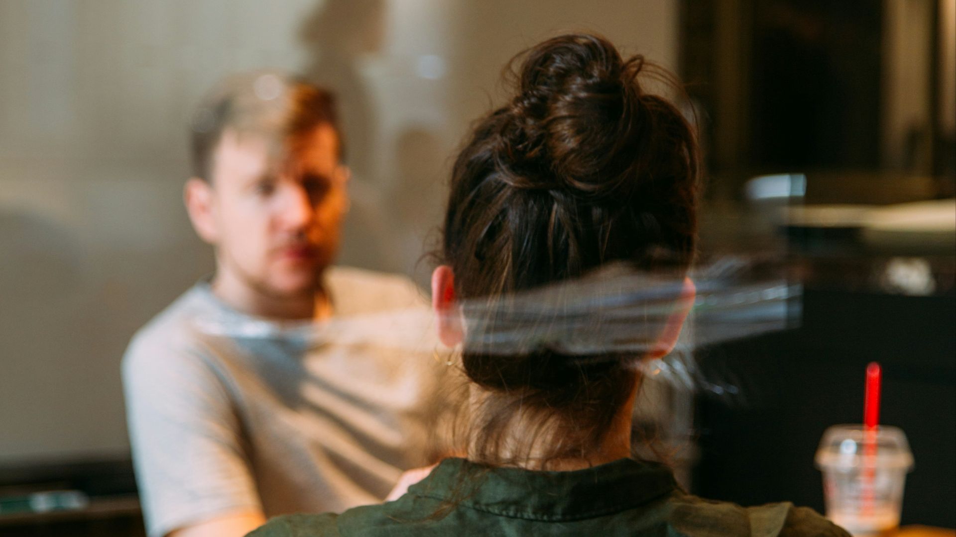 person sitting in a chair in front of a man