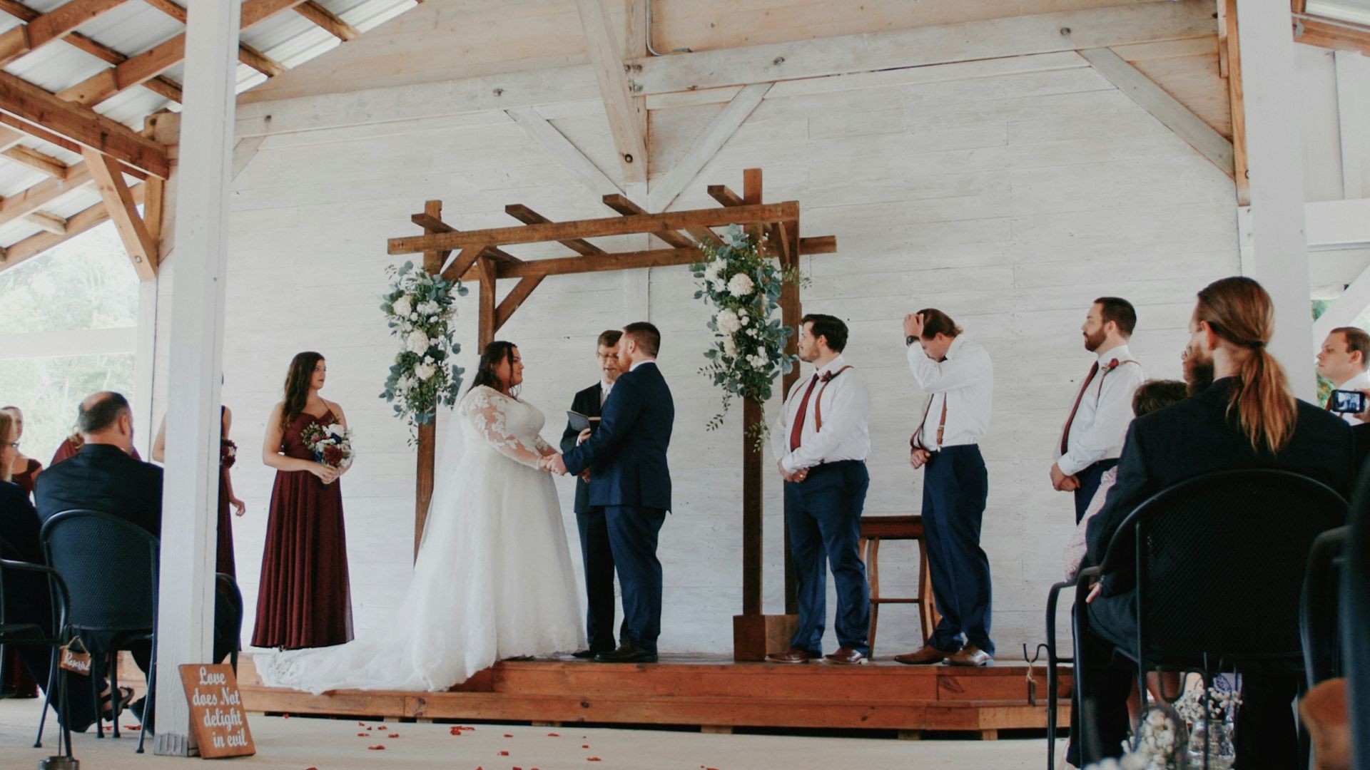 a group of people standing around a wooden structure