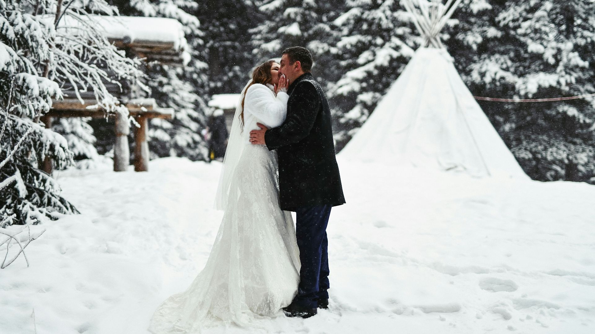 a man that is standing in the snow