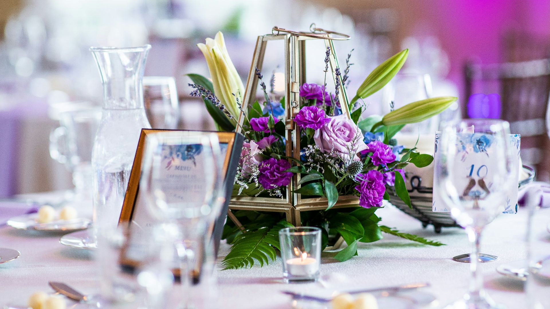 a table with a basket of flowers on top of it