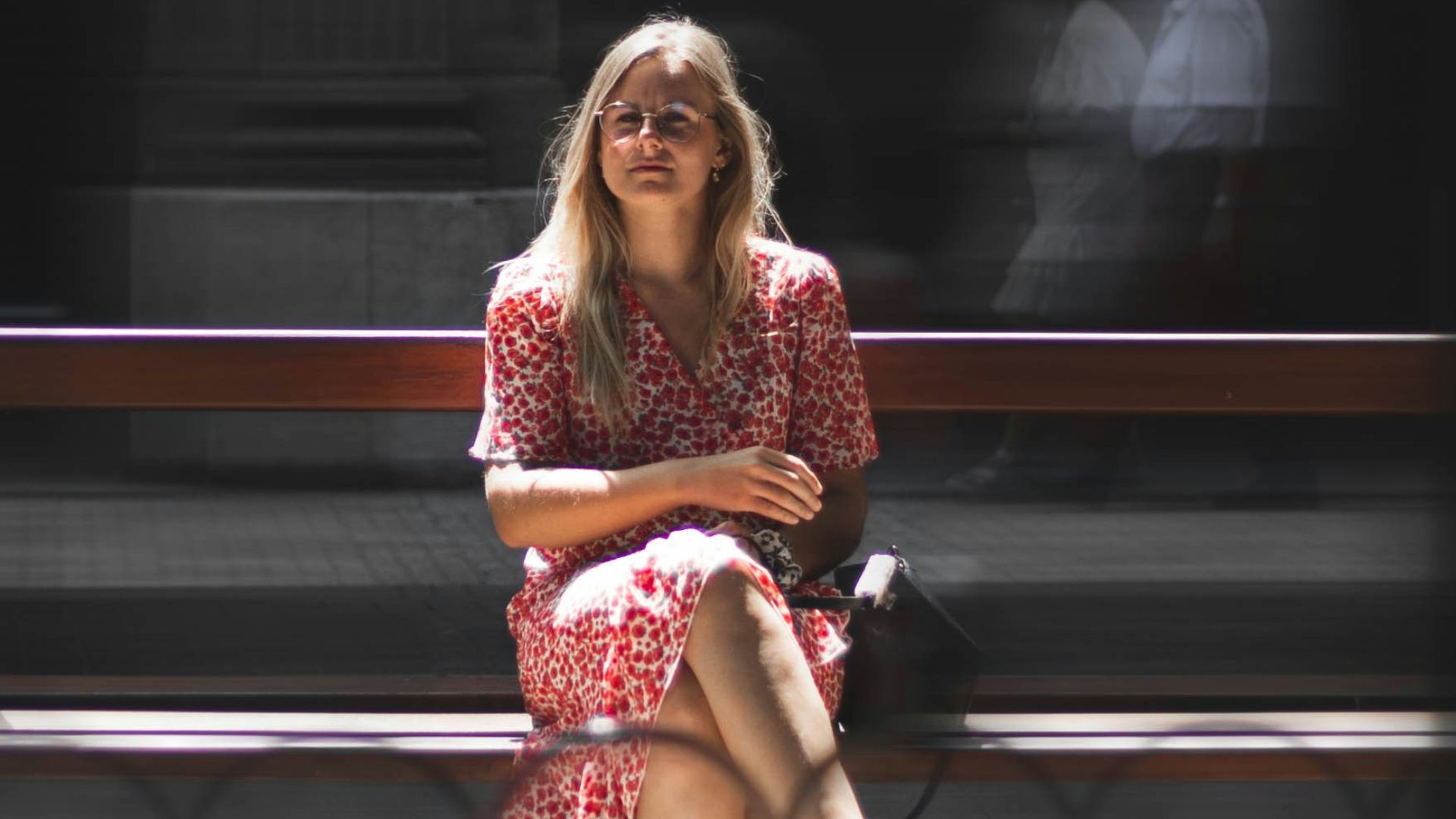 a woman sitting on a bench
