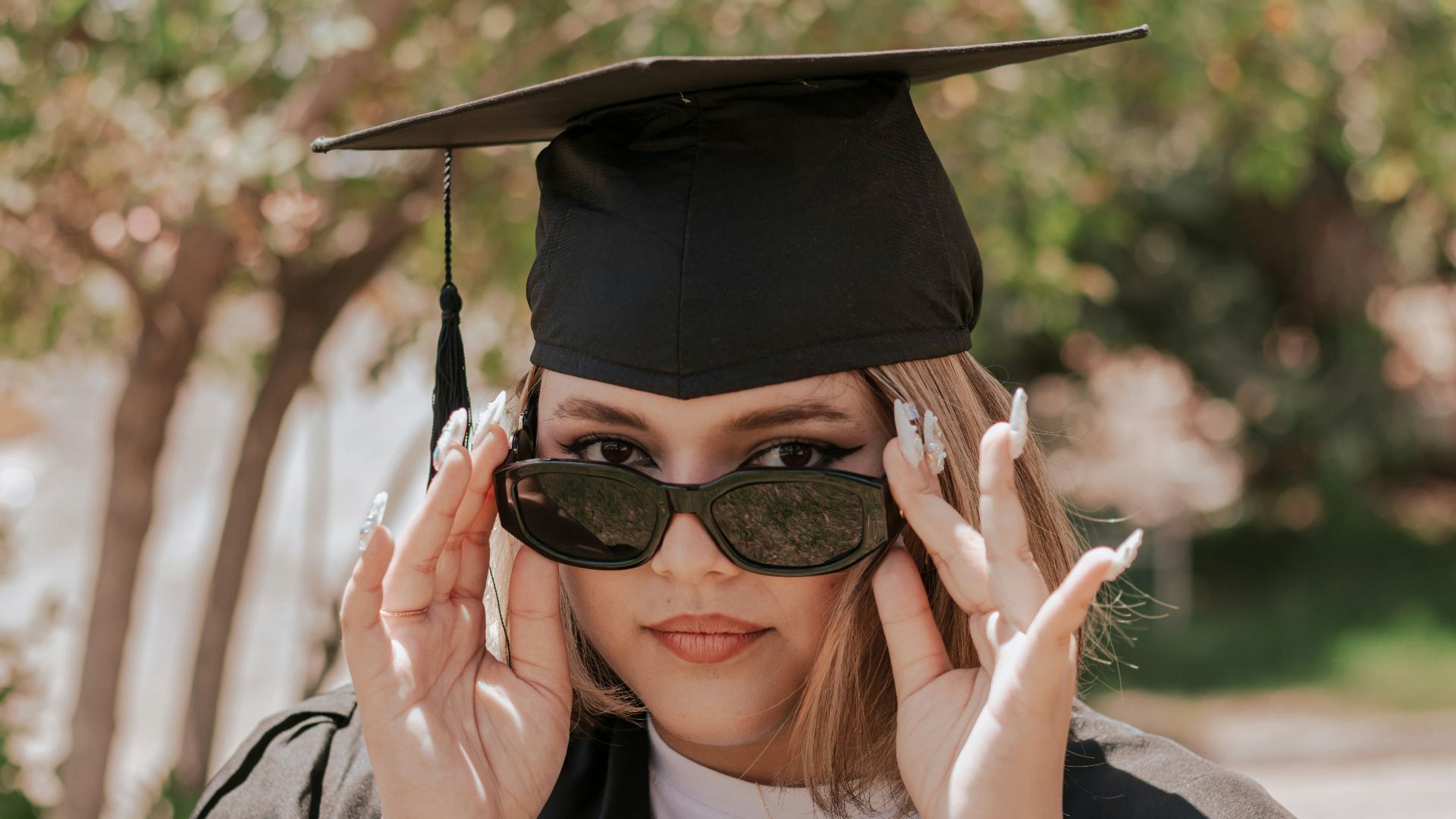 a woman wearing a graduation cap and gown