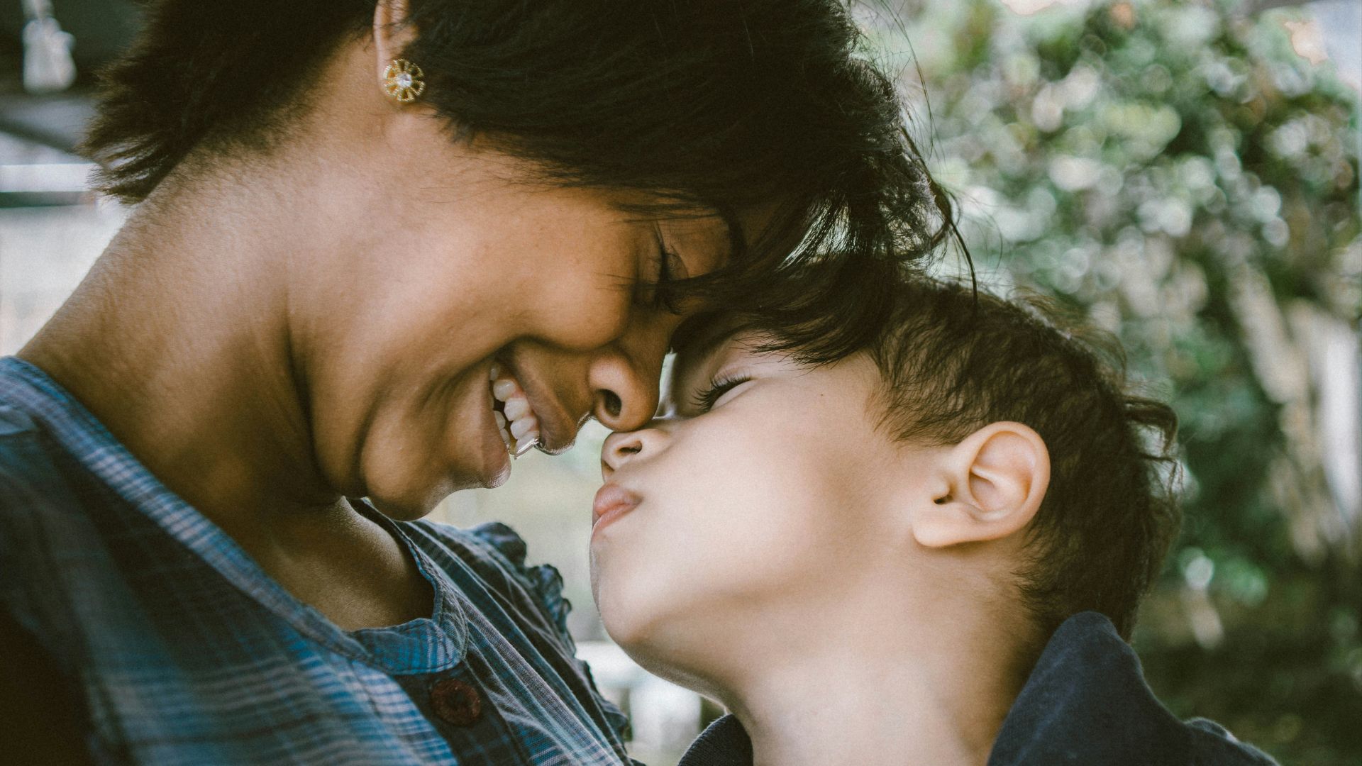 selective focus photography of woman and boy