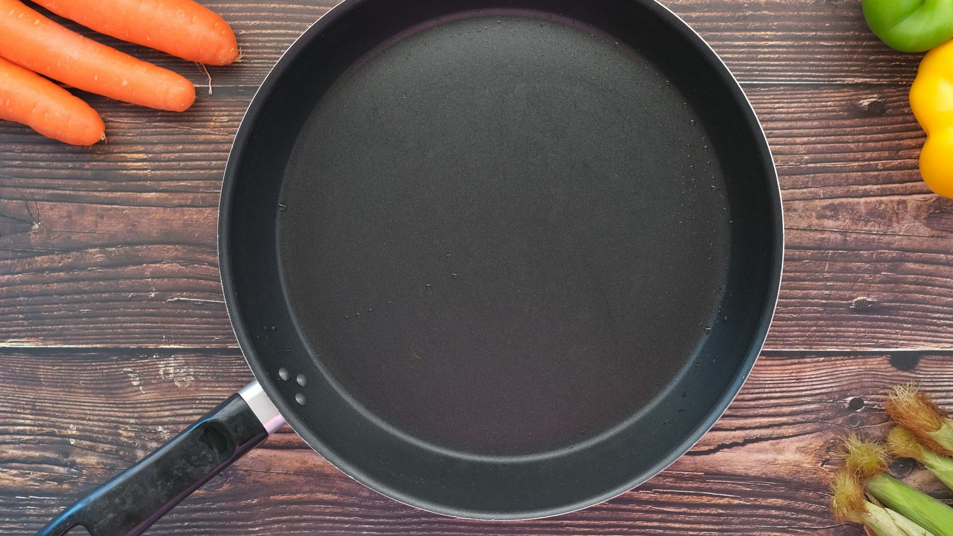 black round plate on brown wooden table