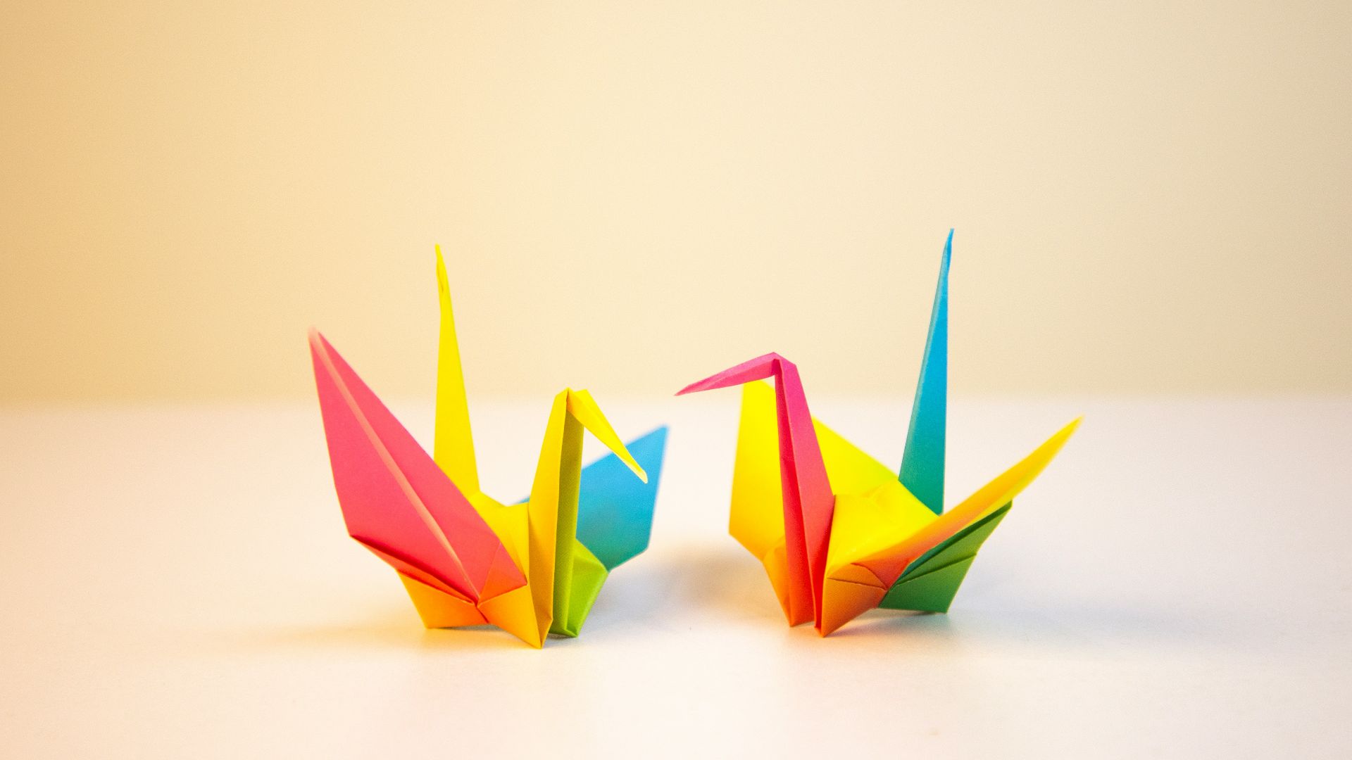 two yellow-red-blue papers