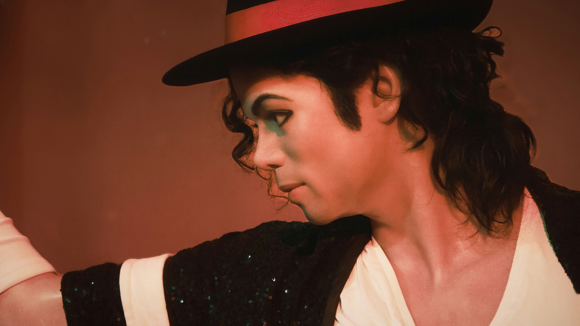 a man in a top hat and black jacket