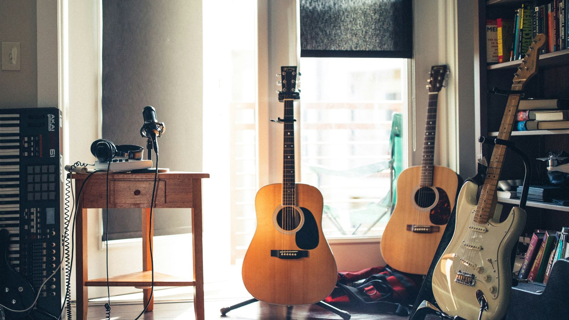 several guitars beside of side table