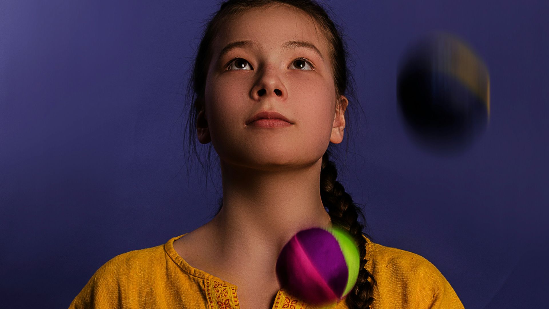 woman playing assorted-color balls
