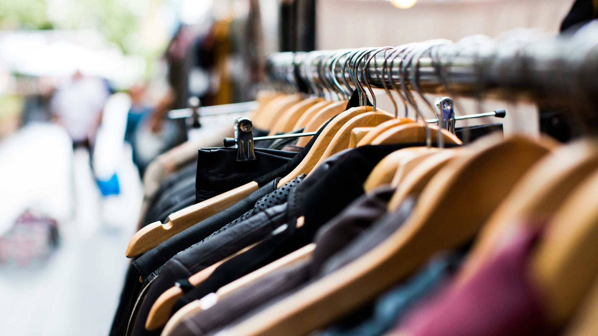 selective focus photography of hanged clothes