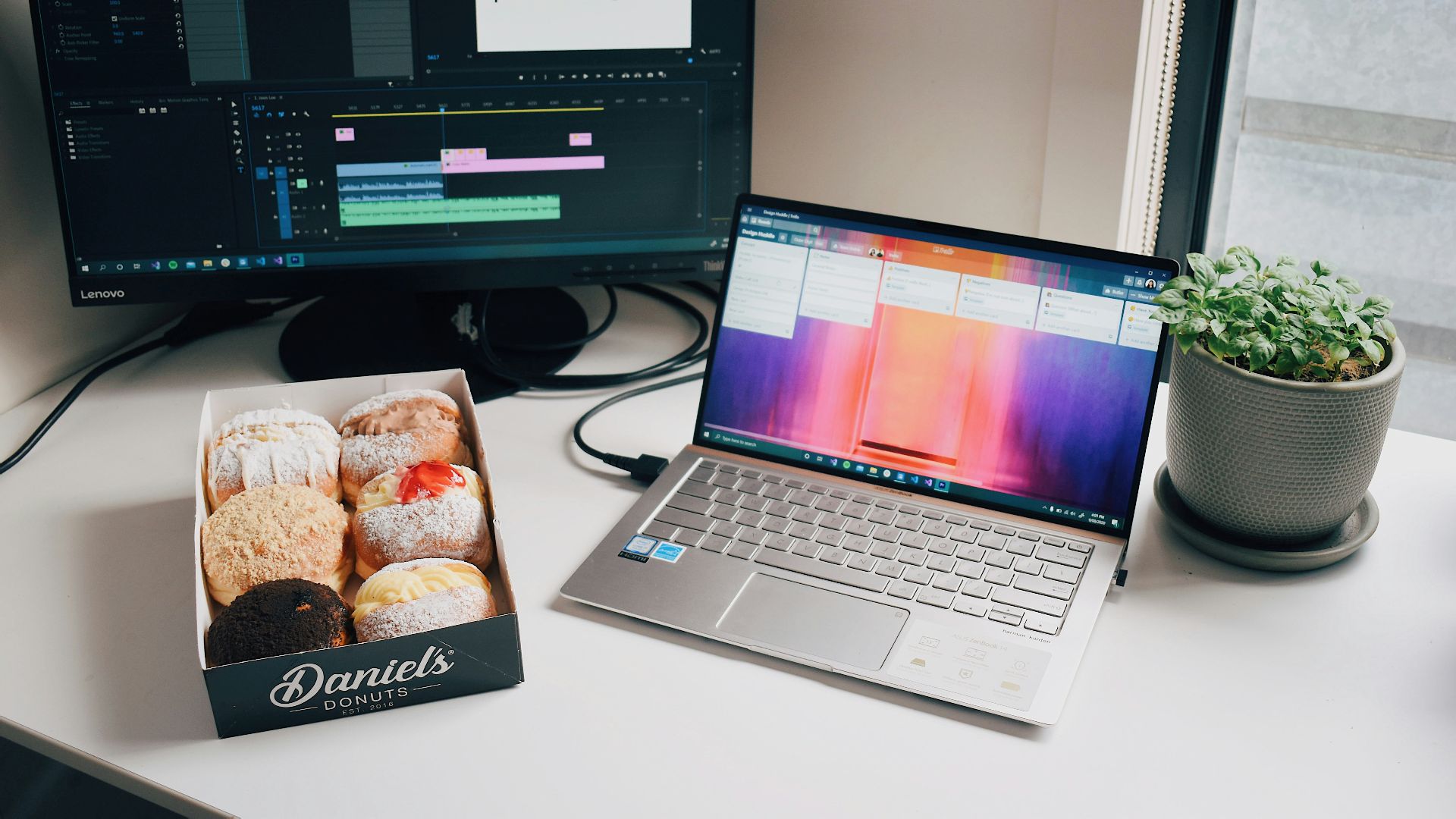 black and gray laptop computer on white table