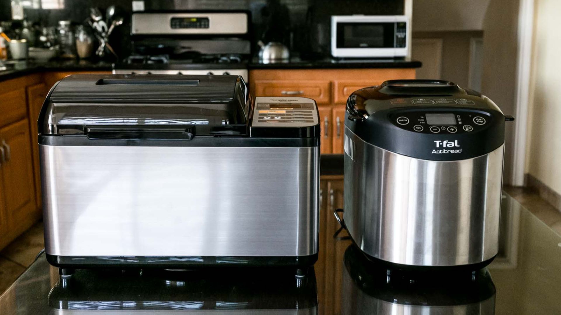 File:Two different models of bread machines.jpg