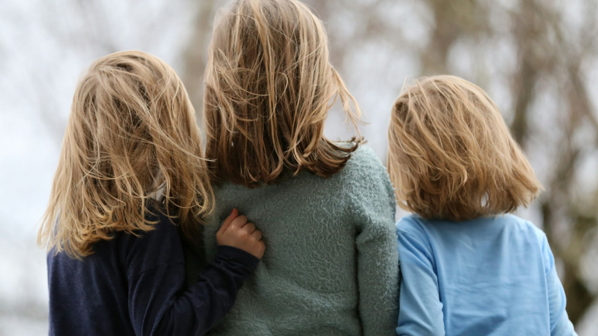 2 women in blue and gray sweaters