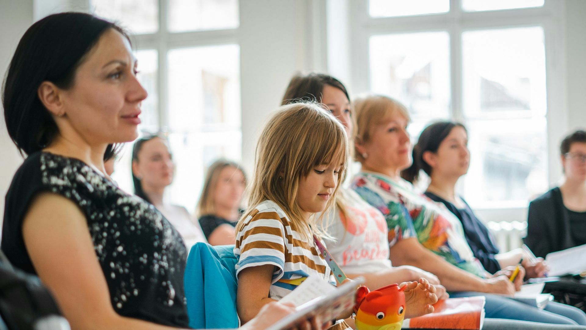 a group of people sitting in a room