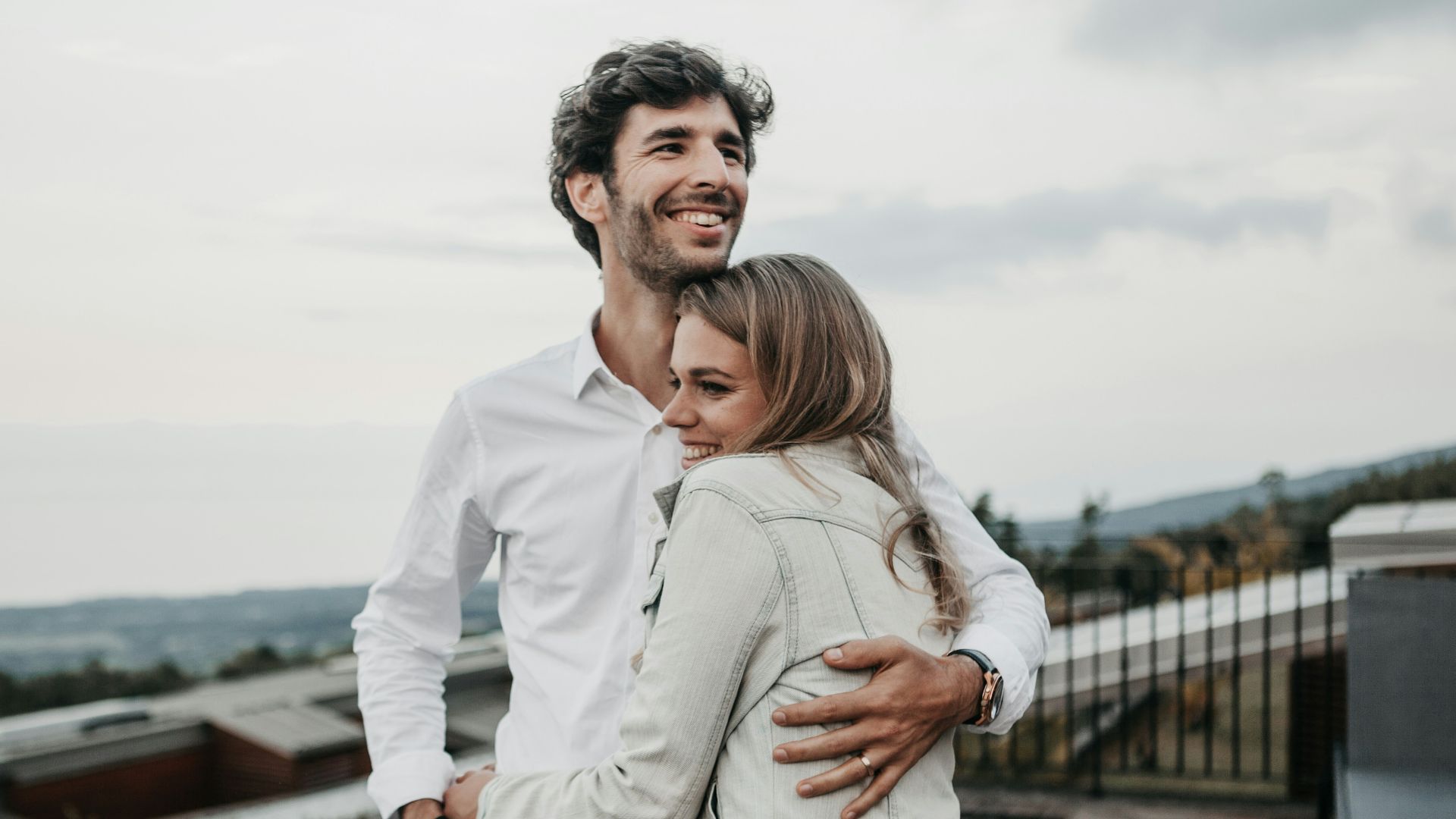 man and woman hugging each other