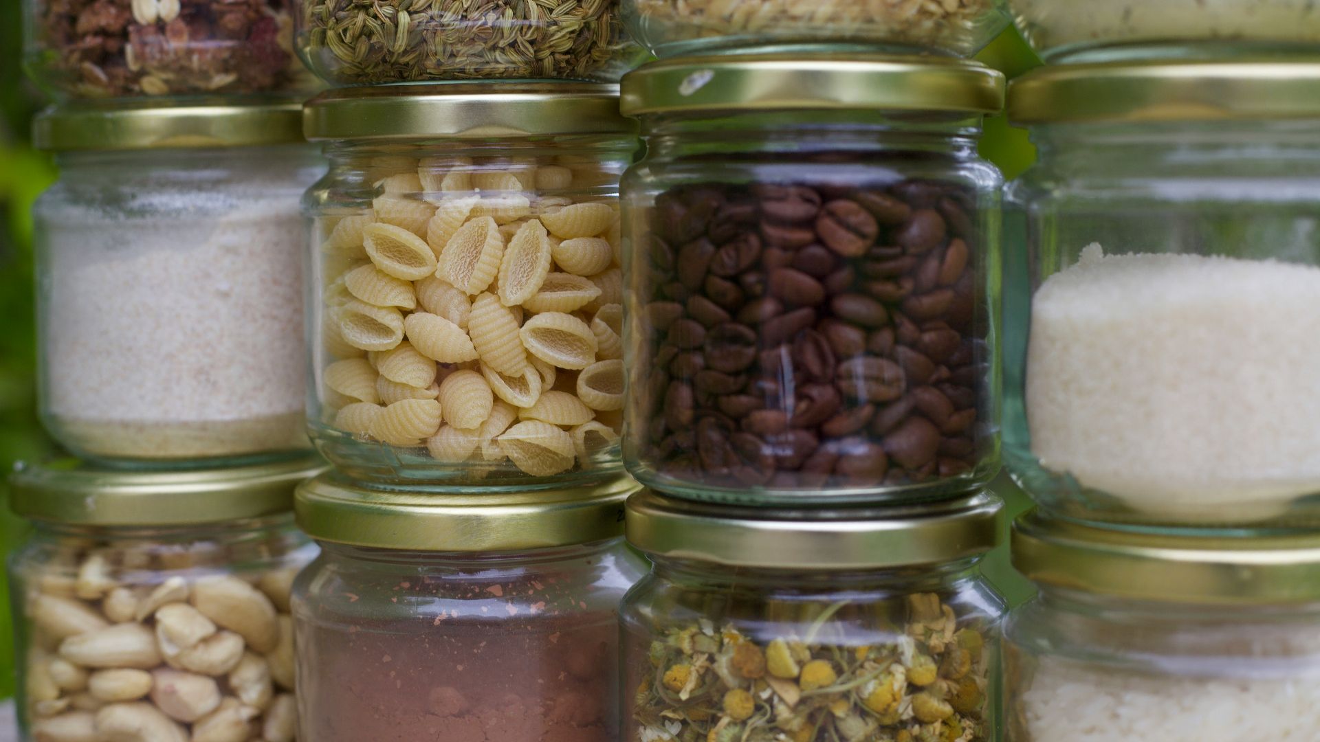 assorted spices in clear glass jars