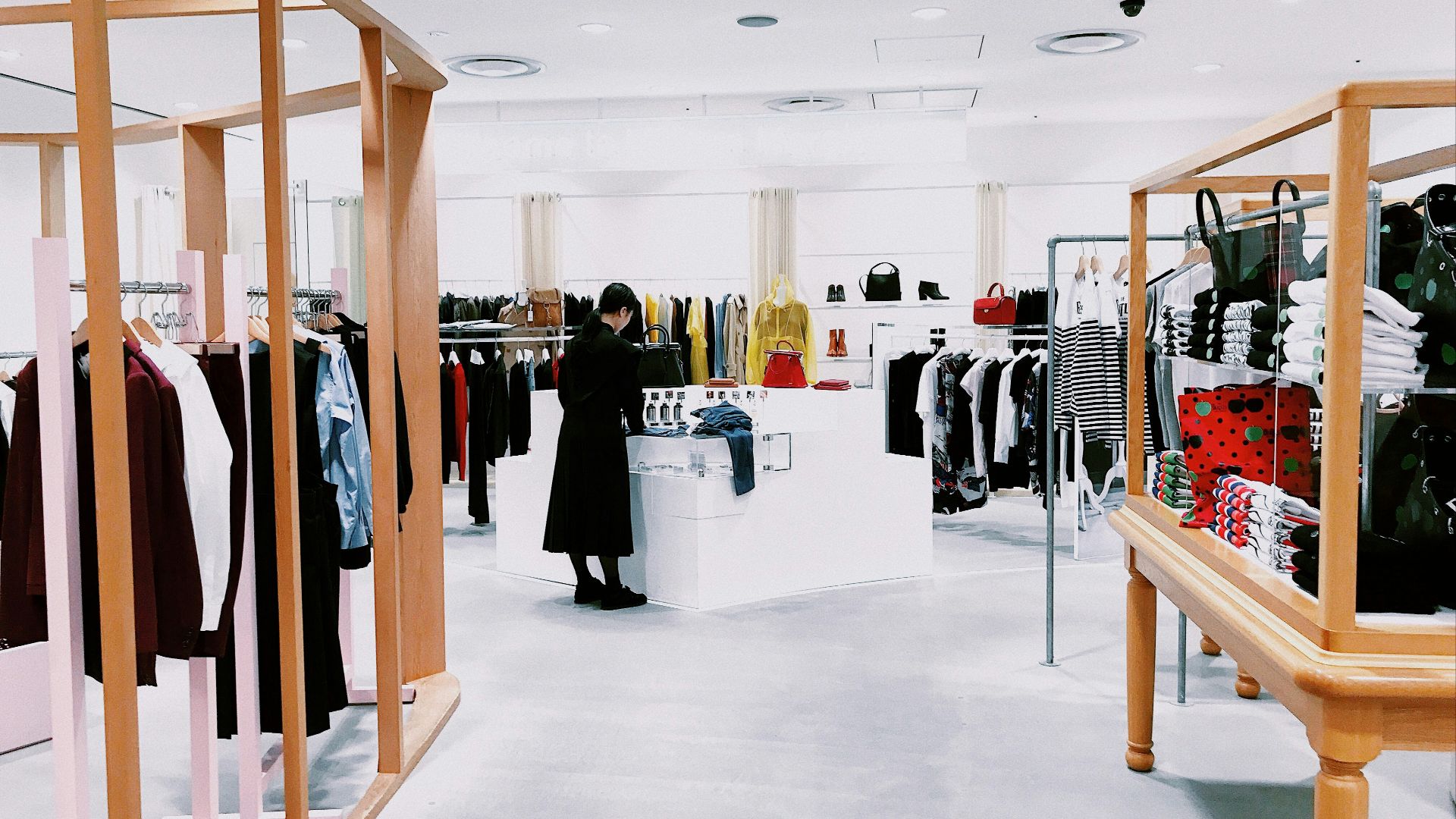 woman standing inside clothing area