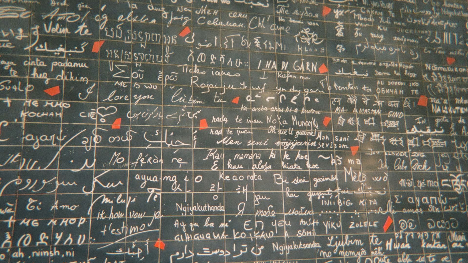 a wall covered in lots of writing on it