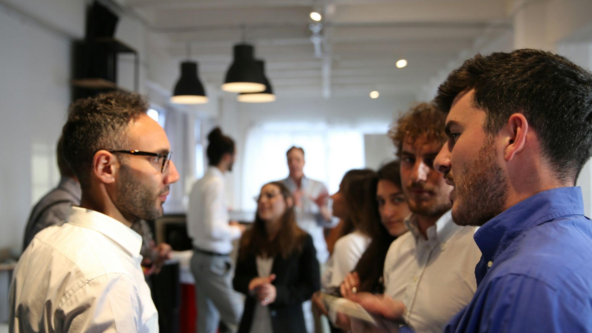a group of people standing in a room