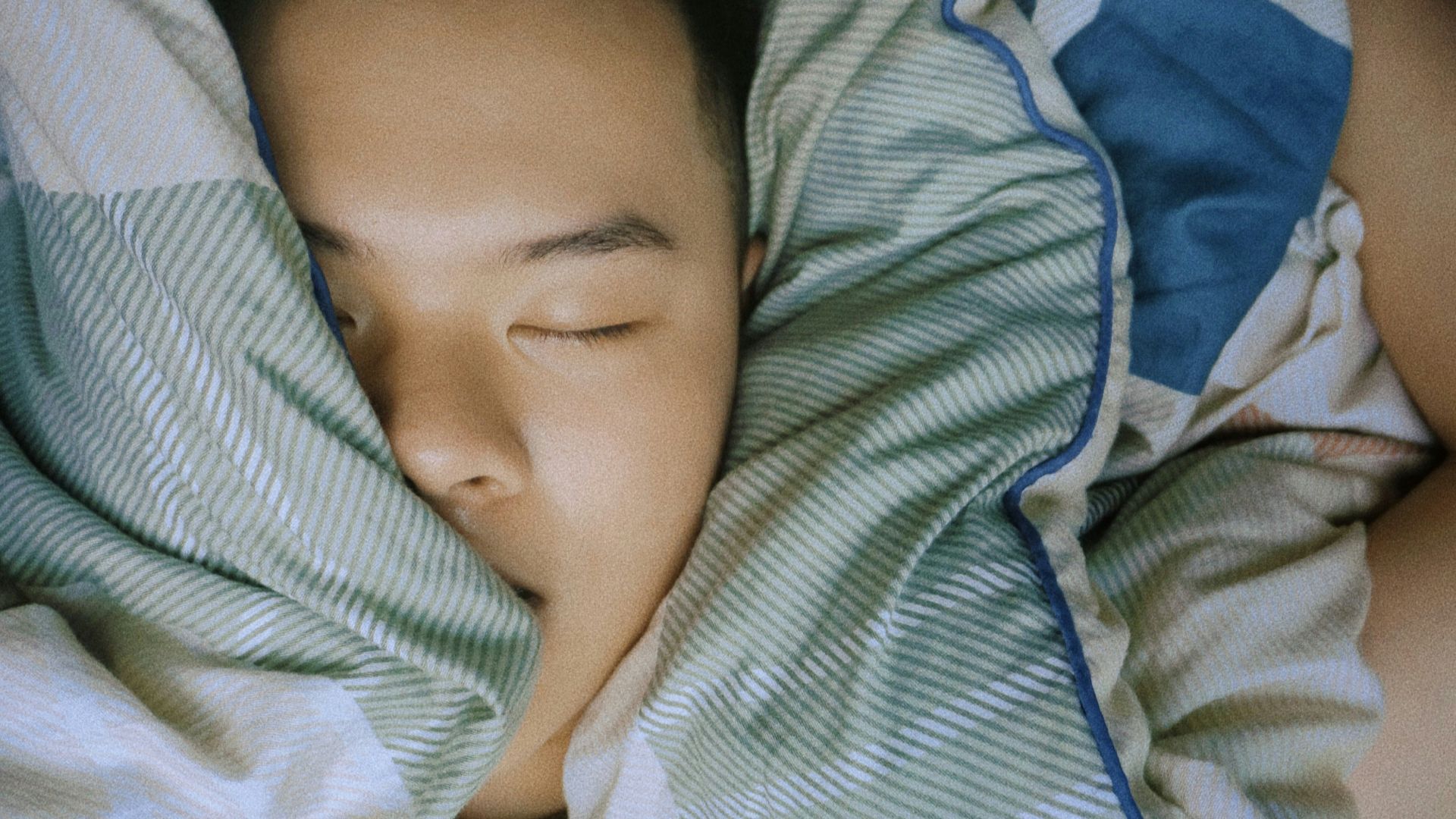 baby in blue and white stripe onesie
