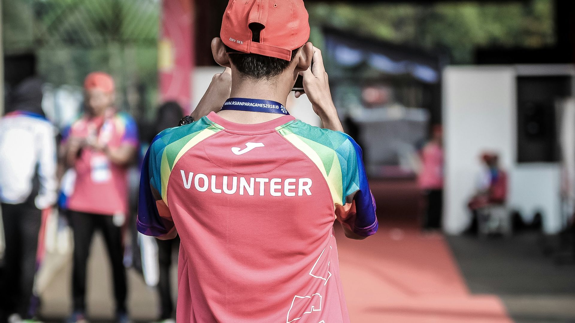 person standing wearing red shirt