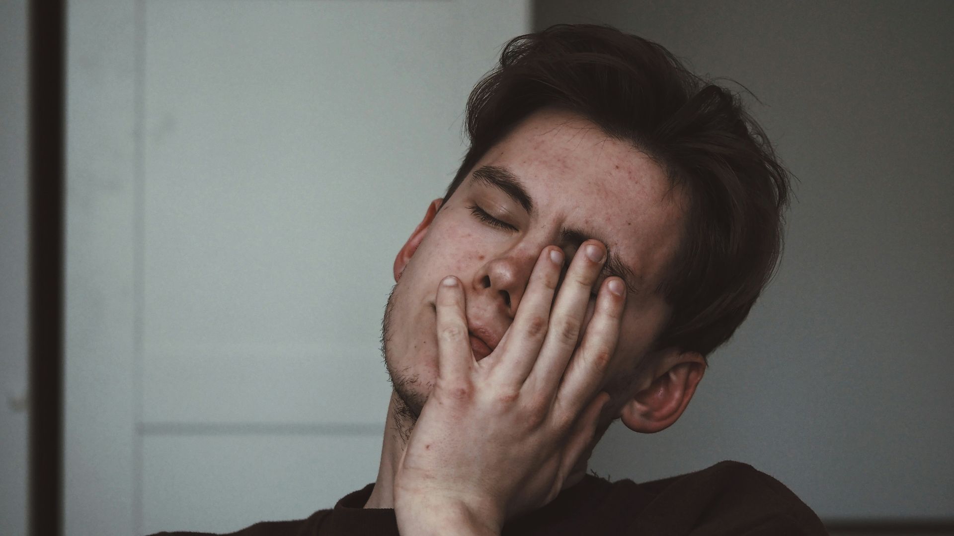 man wearing black crew-neck top