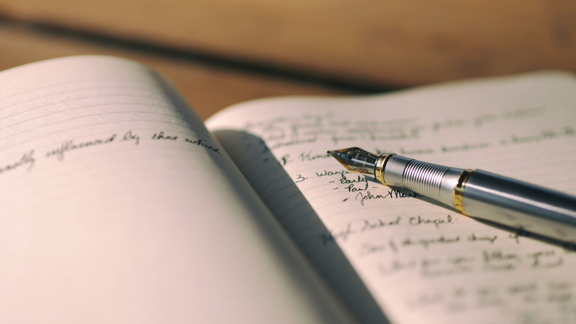 pen on white lined paper selective focus photography