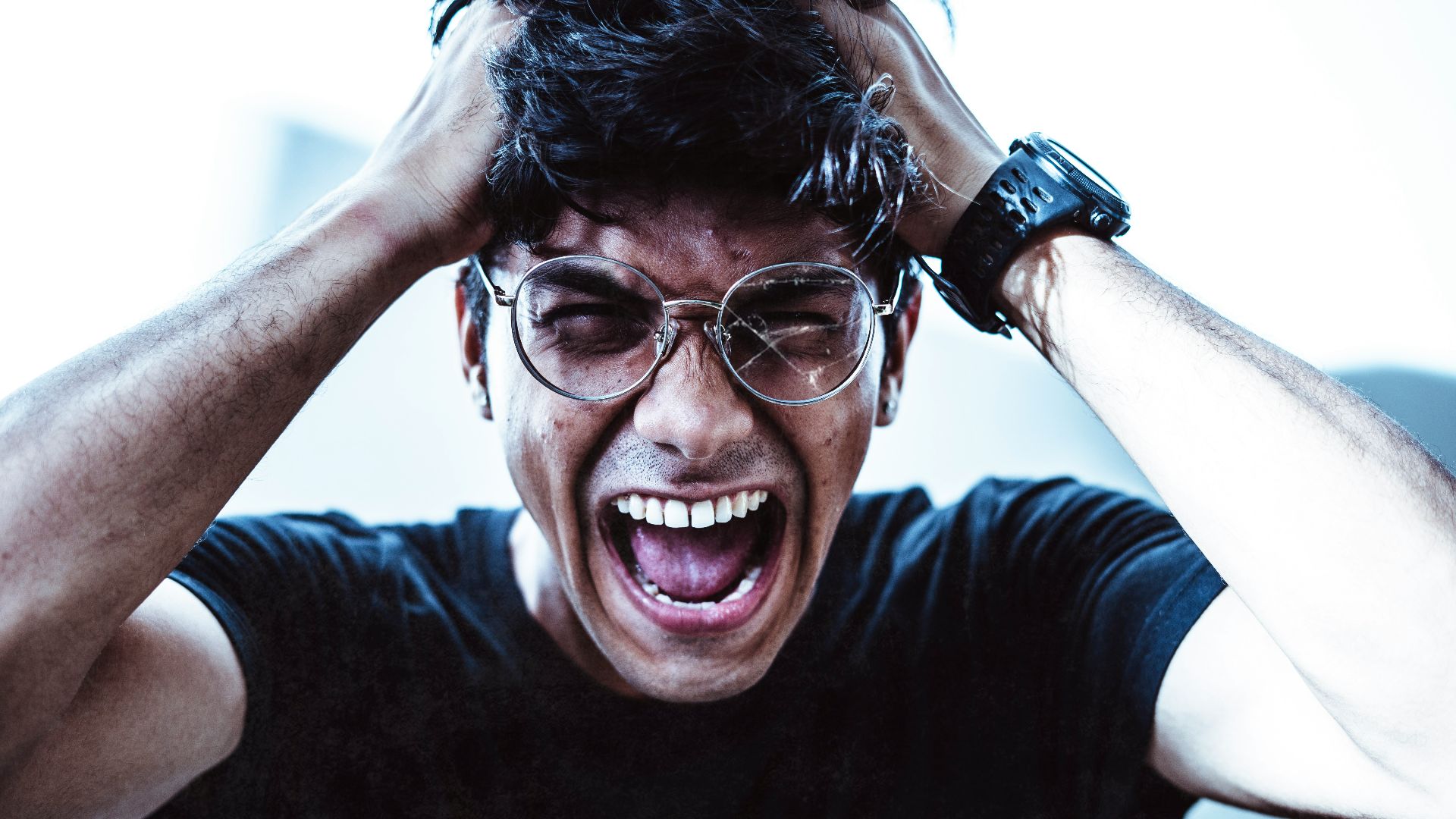 man in black crew neck t-shirt smiling