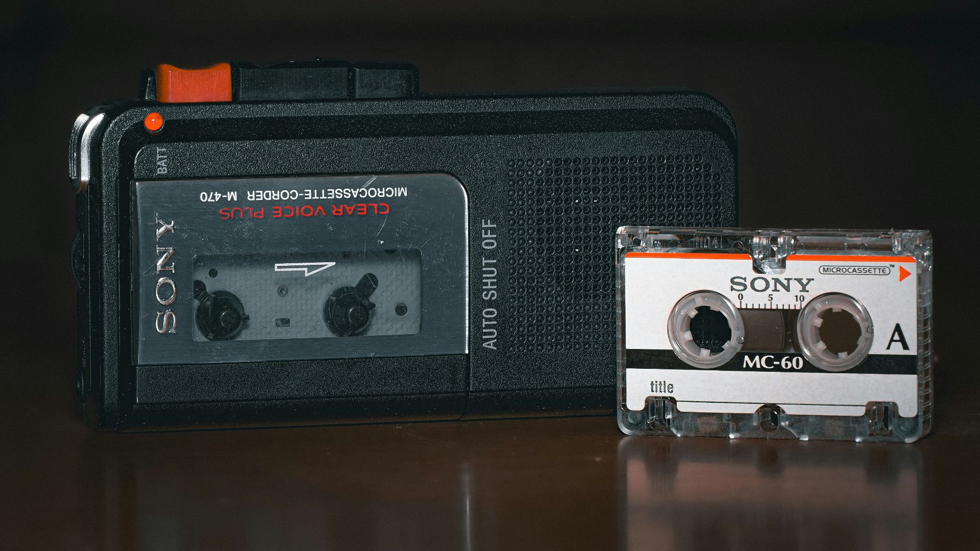 An old radio and a cassette player sitting on a table