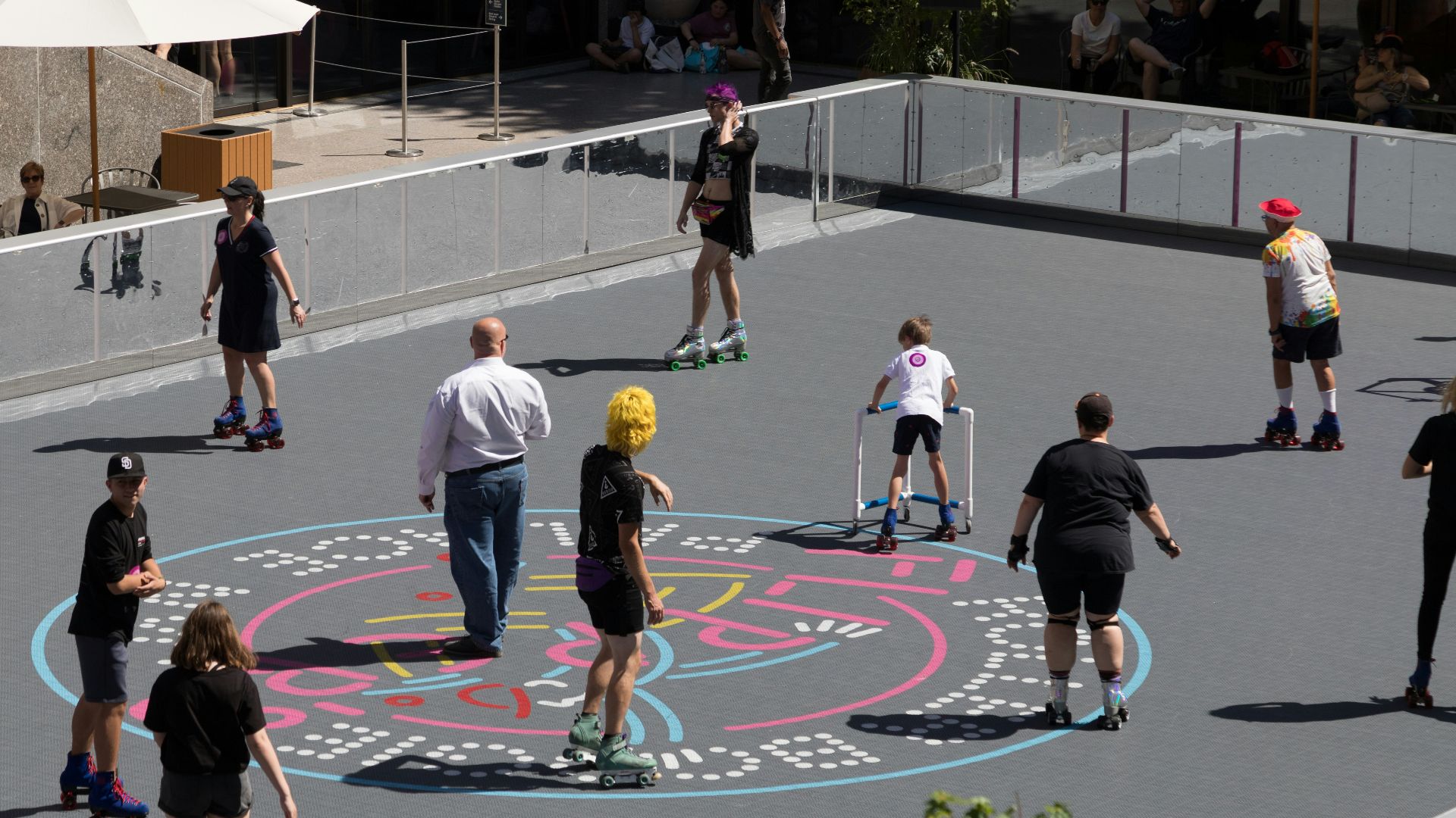 a group of people riding skateboards on top of a parking lot