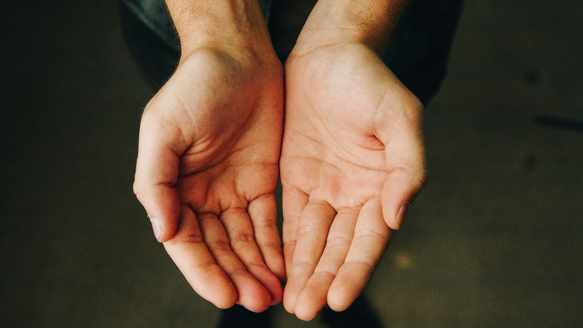 persons hand forming heart
