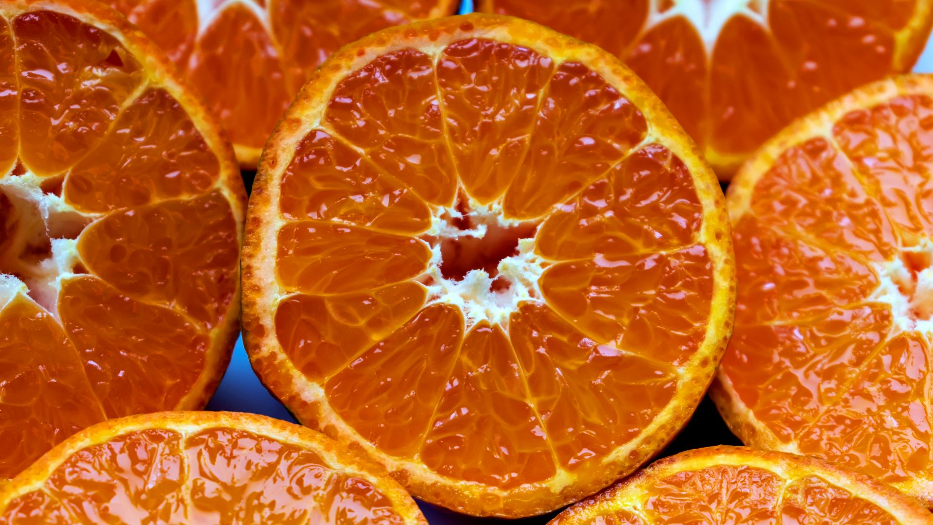 a bunch of oranges that are cut in half