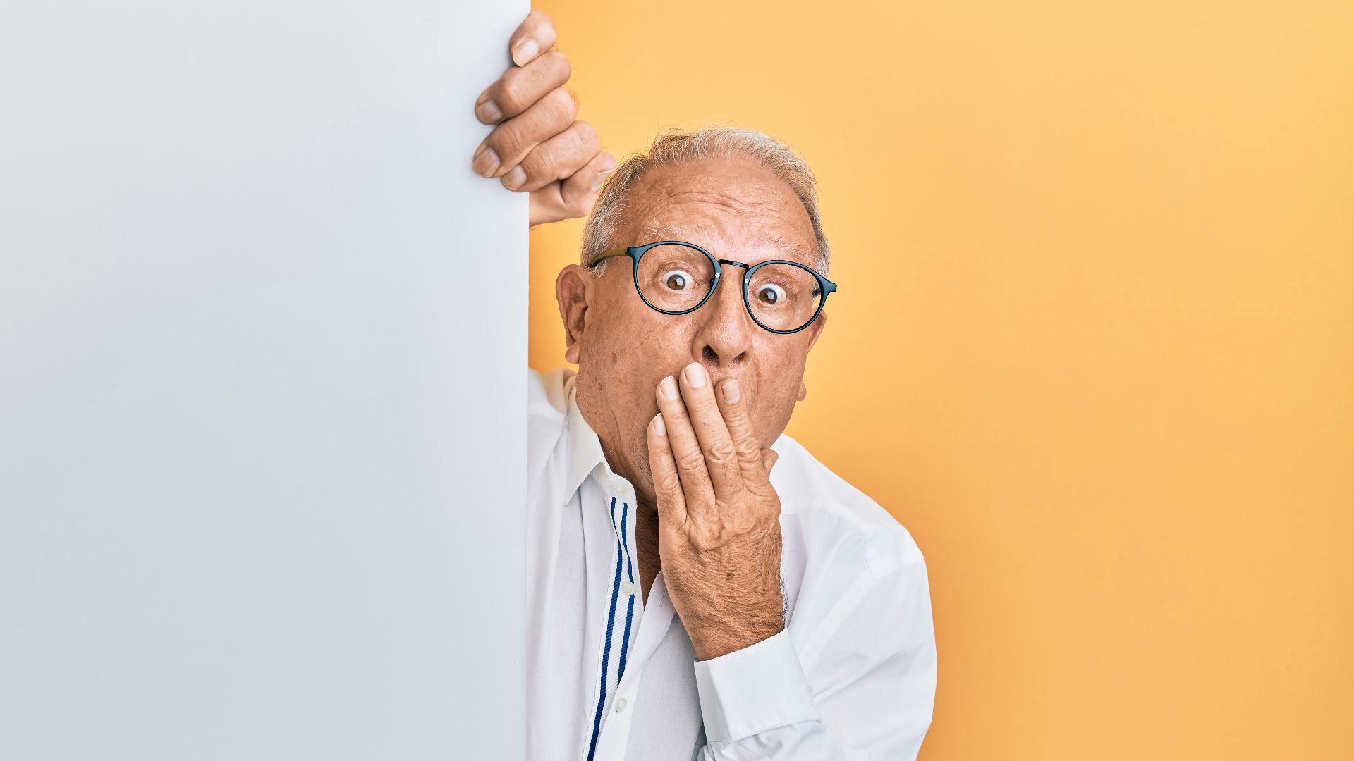 man in white dress shirt wearing black framed eyeglasses