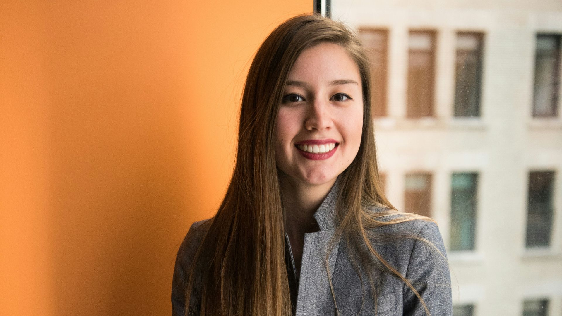 shallow focus photo of woman in gray jacket