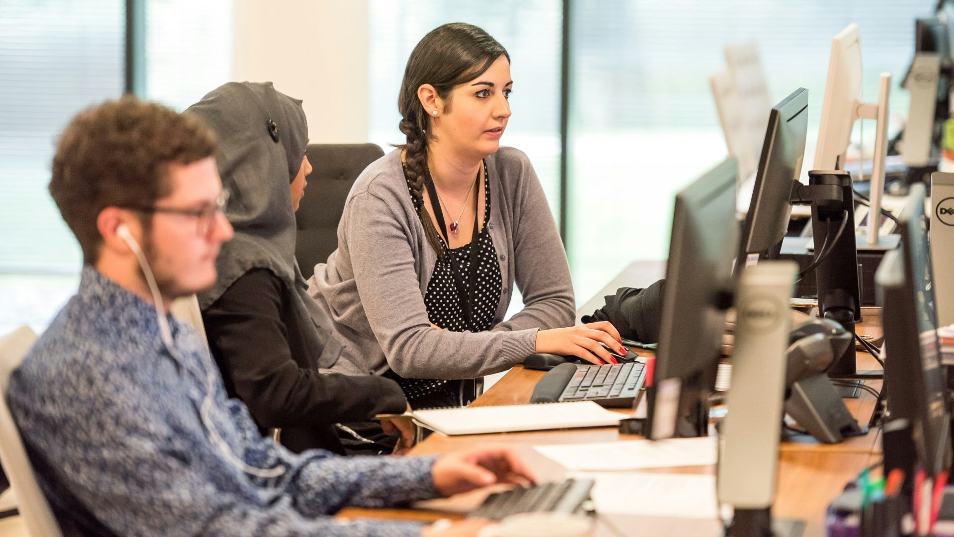 unknown persons using computer indoors