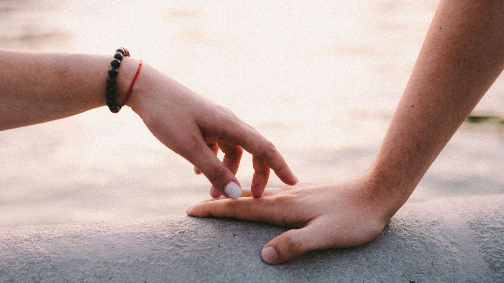 a person holding the hand of another persons hand