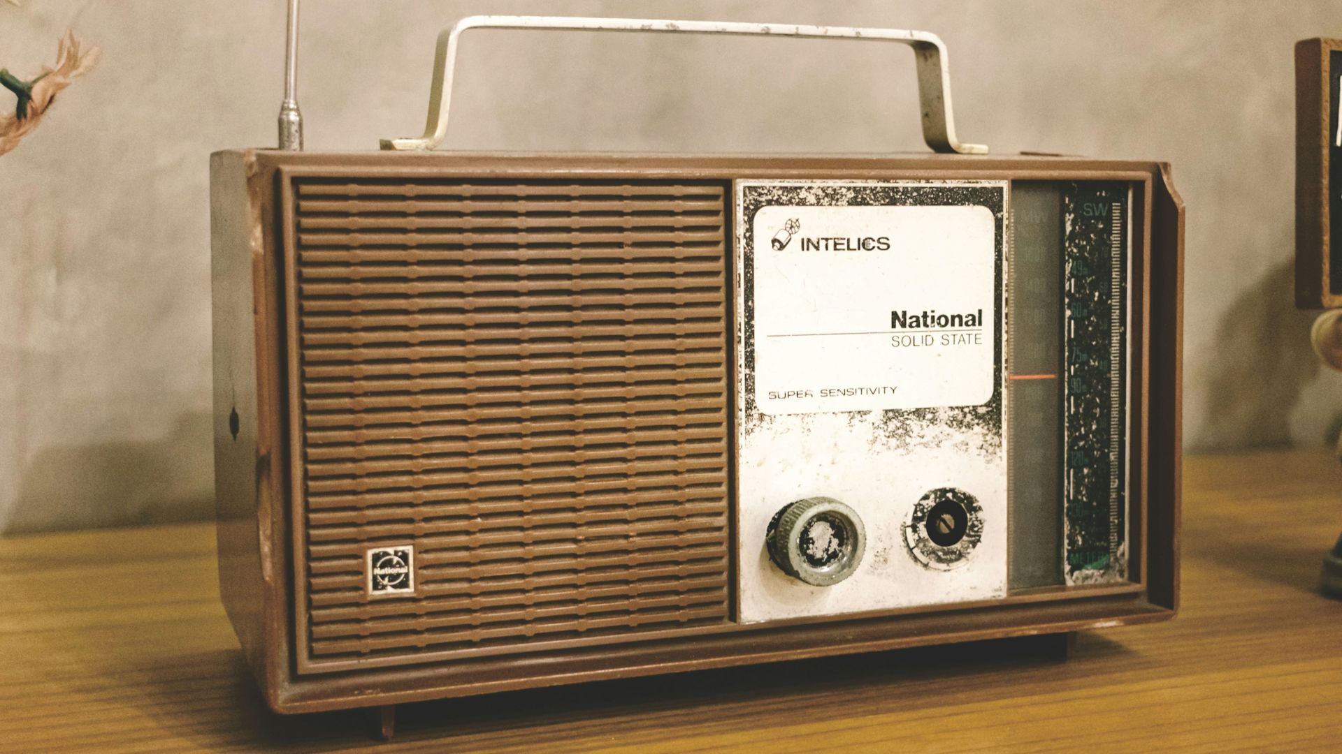 A radio sitting on top of a wooden table