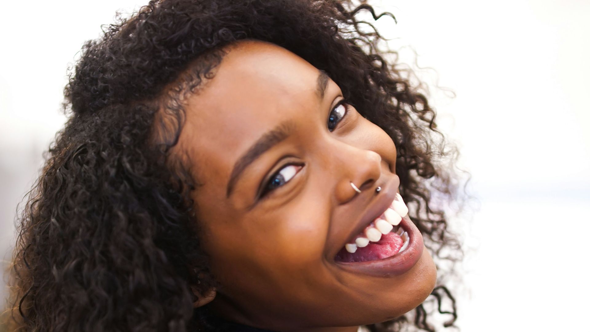 woman looking back while smiling