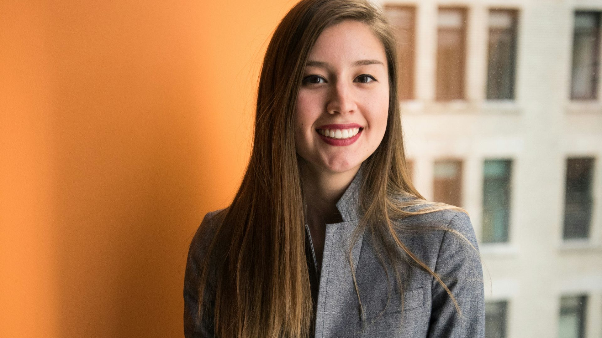 shallow focus photo of woman in gray jacket