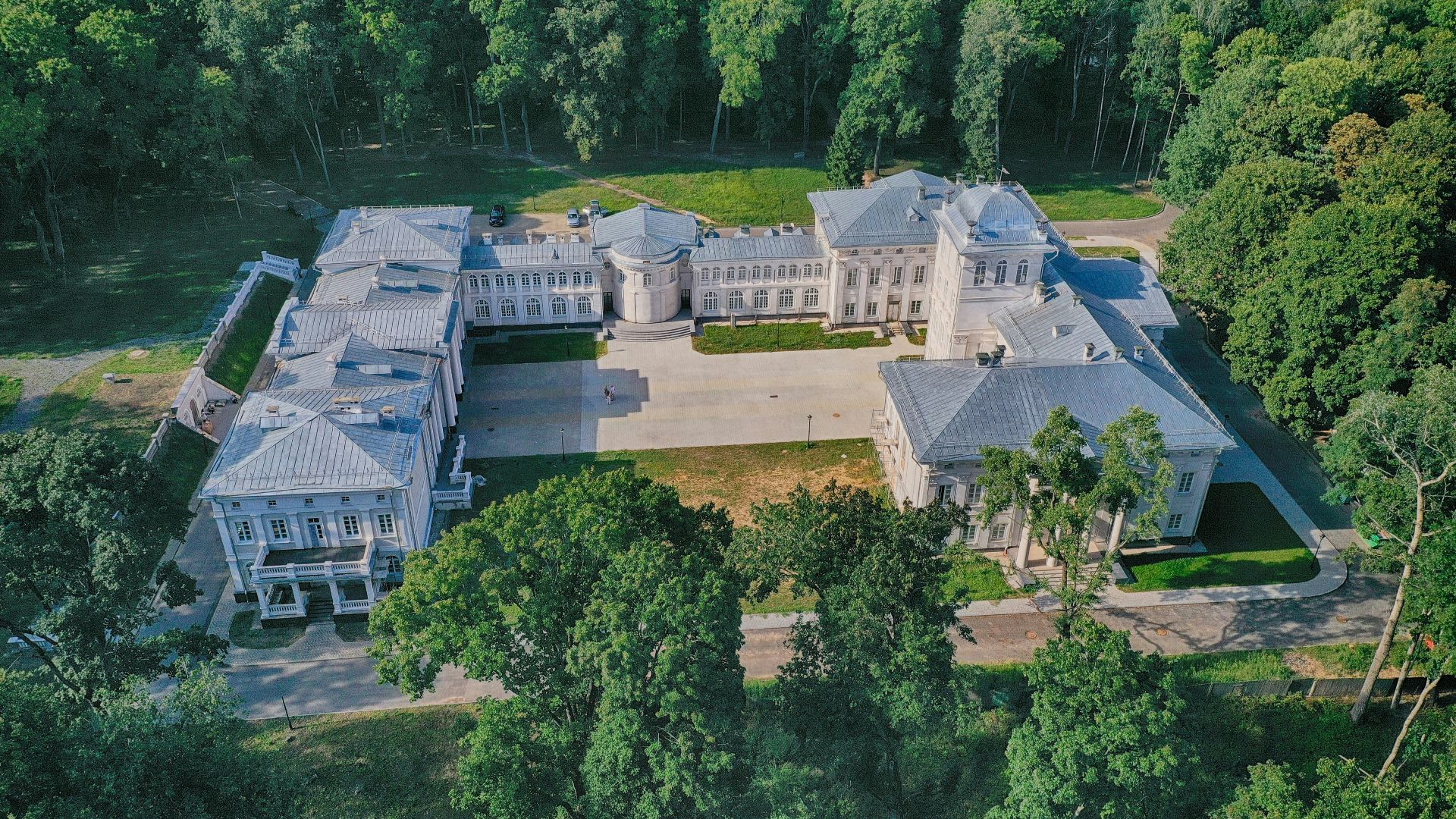 aerial view of green trees and white building during daytime
