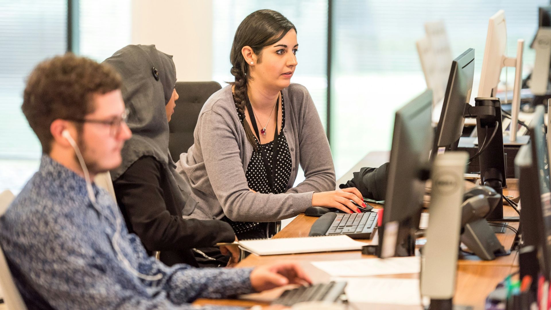 unknown persons using computer indoors
