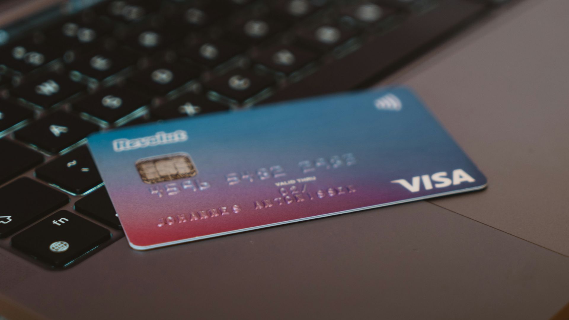 blue and white visa card on silver laptop computer
