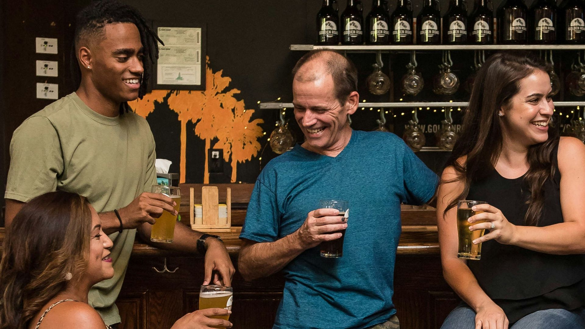 standing man wearing blue V-neck t-shirt
