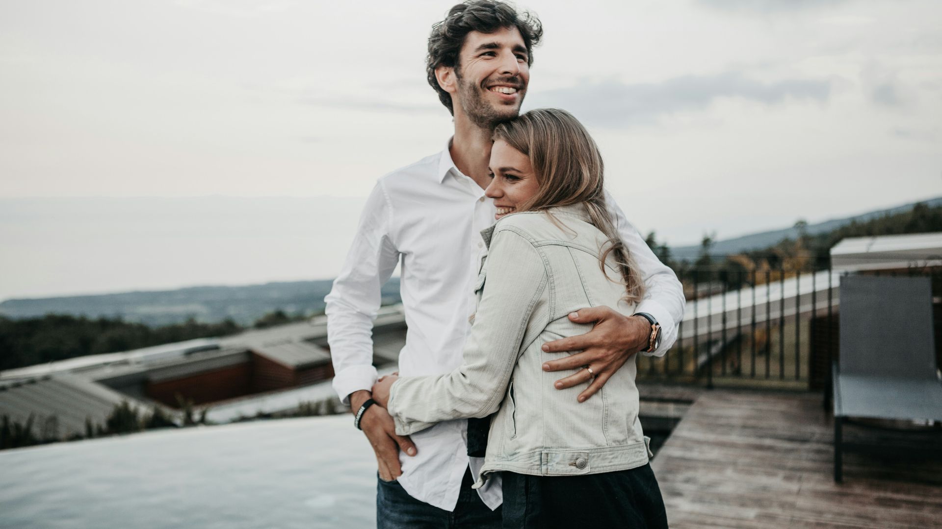 man and woman hugging each other