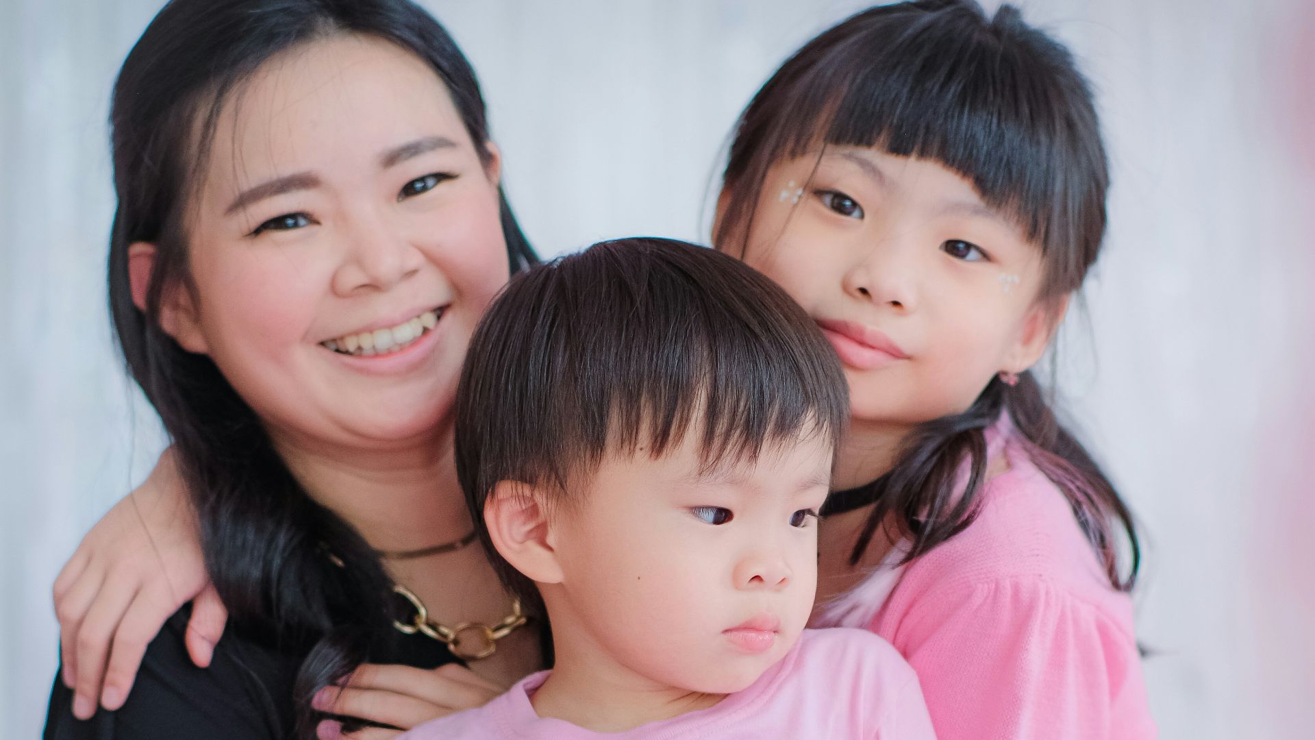 a woman and two children