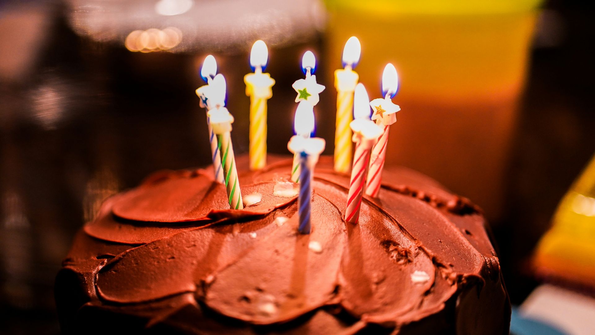 brown cake with candles on top
