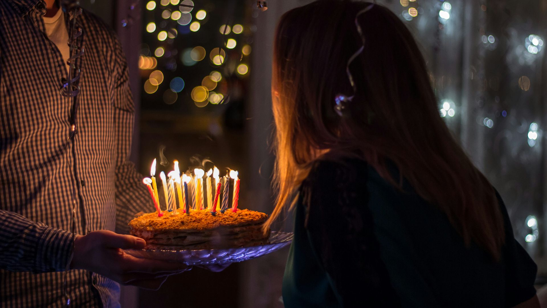 photo of birthday birth about to blow birthday candles