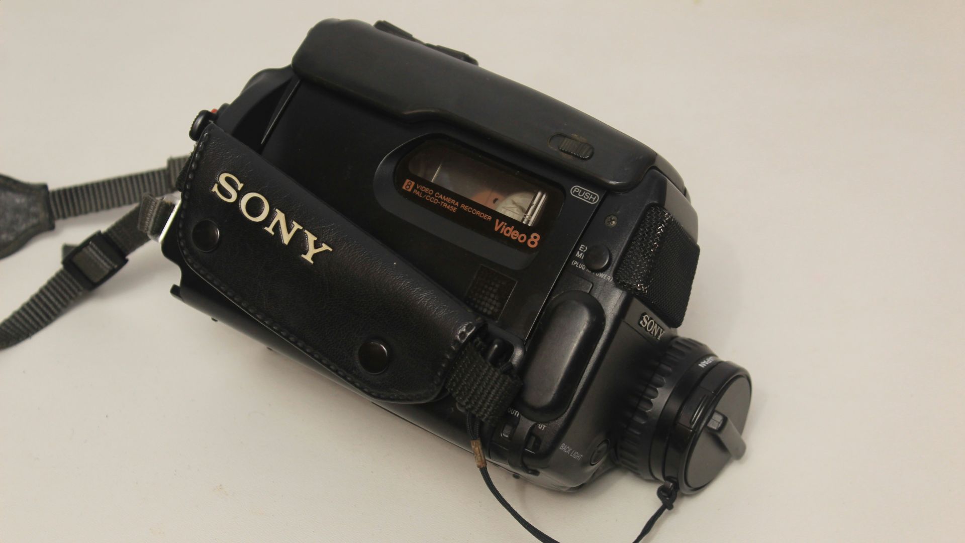 a sony camera sitting on a white table
