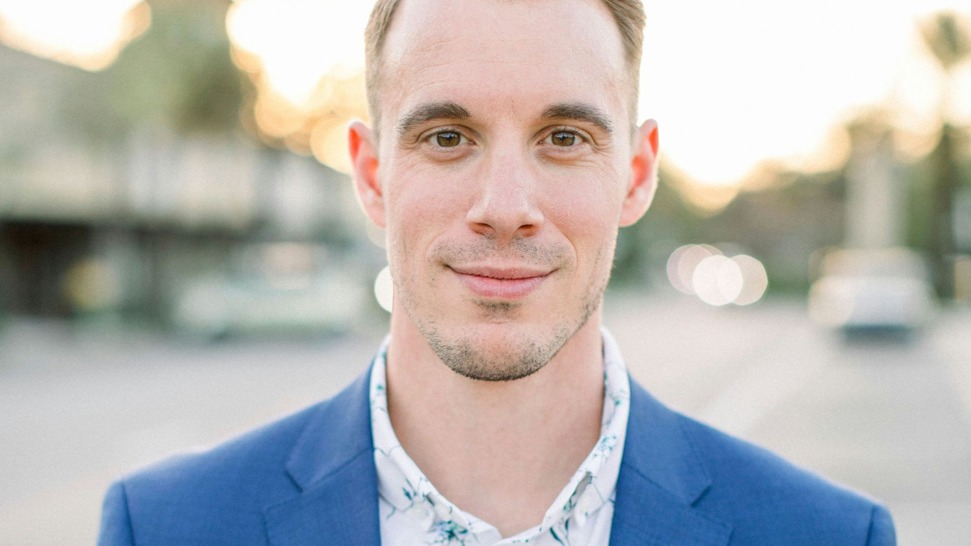 man in blue suit jacket